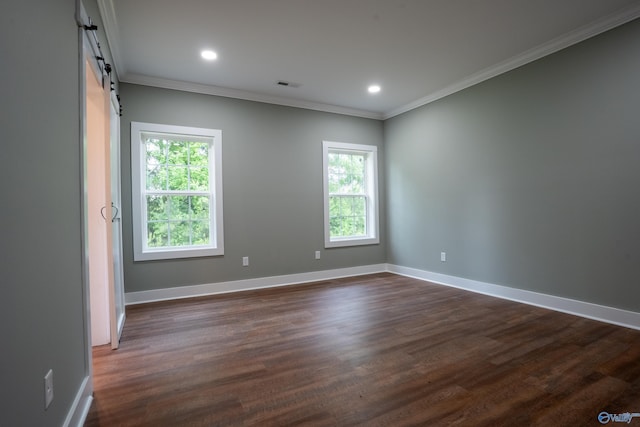 55 Edgewood St, Rainsville, AL 35986 - spare room featuring healthy amount of natural light, a barn door, crown molding, dark wood-style flooring, and baseboards