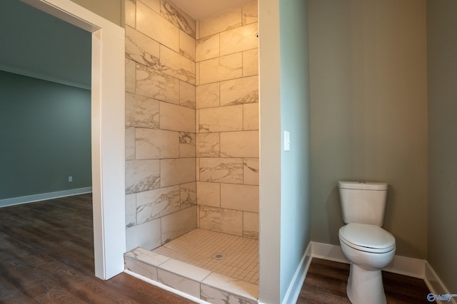 55 Edgewood St, Rainsville, AL 35986 - full bath featuring toilet, a stall shower, wood finished floors, and baseboards