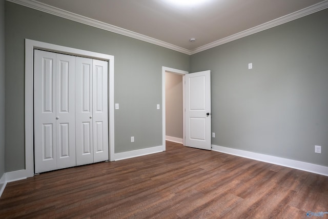 55 Edgewood St, Rainsville, AL 35986 - unfurnished bedroom featuring ornamental molding, dark wood-type flooring, baseboards, and a closet