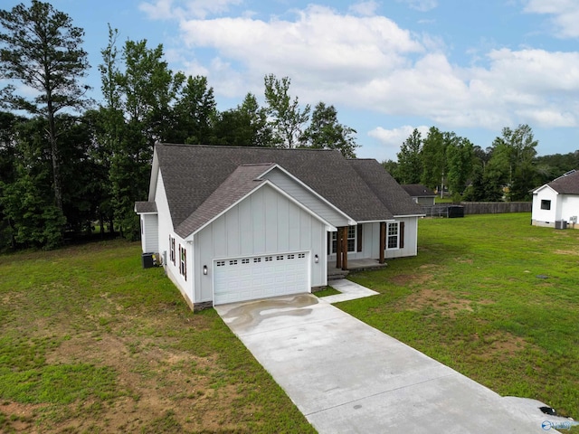 55 Edgewood St, Rainsville, AL 35986 - view of front of property with board and batten siding, driveway, a garage, and a shingled roof