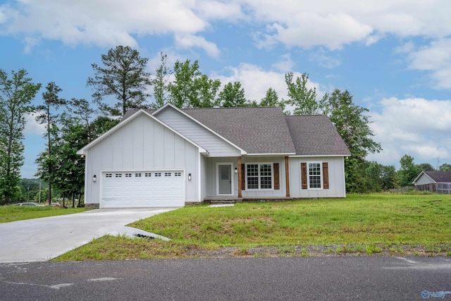 55 Edgewood St, Rainsville, AL 35986 - view of front of house with board and batten siding, an attached garage, driveway, a front yard, and roof with shingles