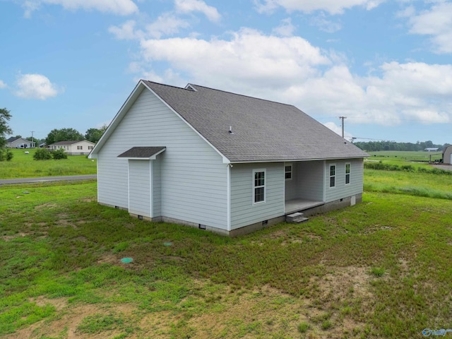 55 Edgewood St, Rainsville, AL 35986 - rear view of property with a shingled roof, crawl space, and a yard