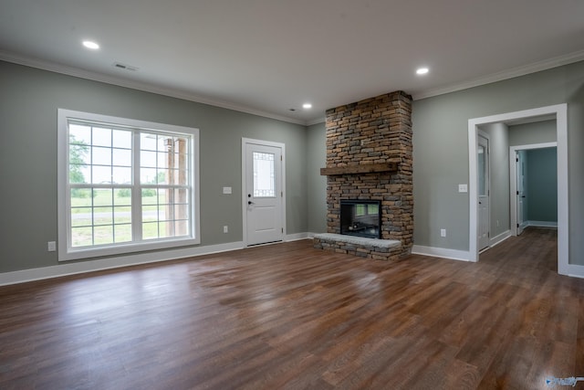 55 Edgewood St, Rainsville, AL 35986 - unfurnished living room featuring crown molding, a stone fireplace, dark wood-style floors, baseboards, and recessed lighting