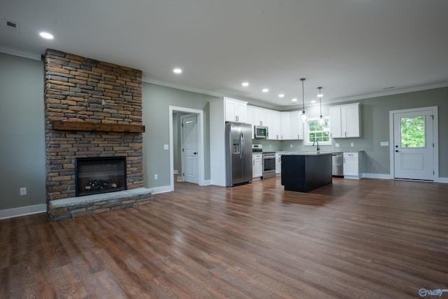 55 Edgewood St, Rainsville, AL 35986 - kitchen featuring appliances with stainless steel finishes, open floor plan, crown molding, a sink, and white cabinetry