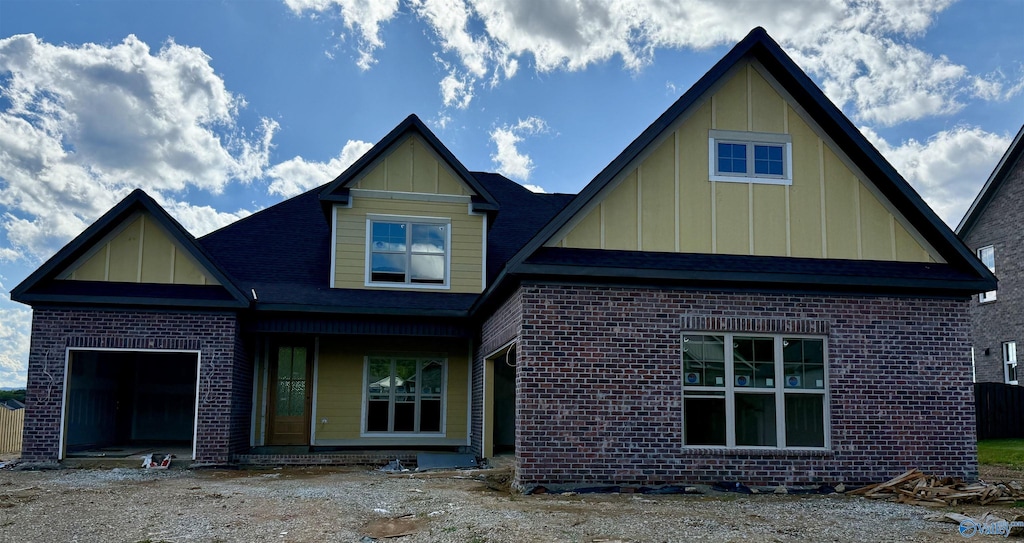 7008 High Park Trce, Gurley, AL 35748 - view of front of house featuring board and batten siding, brick siding, and a garage