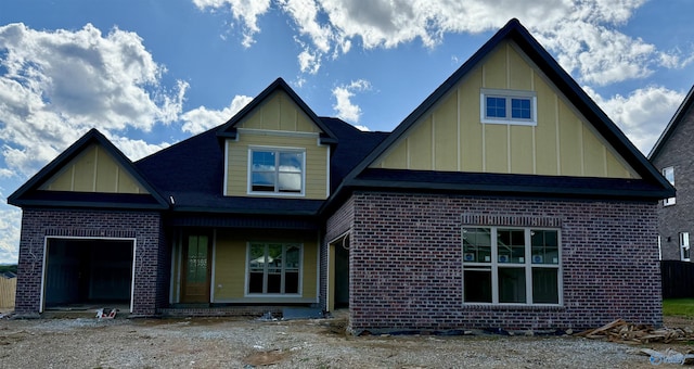 7008 High Park Trce, Gurley, AL 35748 - view of front of house featuring board and batten siding, brick siding, and a garage