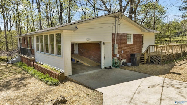 exterior space featuring concrete driveway