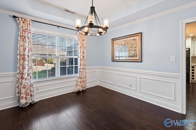 unfurnished dining area featuring a chandelier and dark wood-type flooring