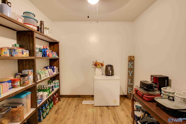 office area with ceiling fan and light hardwood / wood-style floors