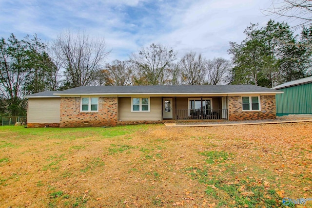 view of front of property with covered porch and a front yard