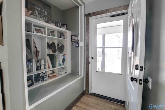 doorway to outside featuring plenty of natural light and hardwood / wood-style flooring