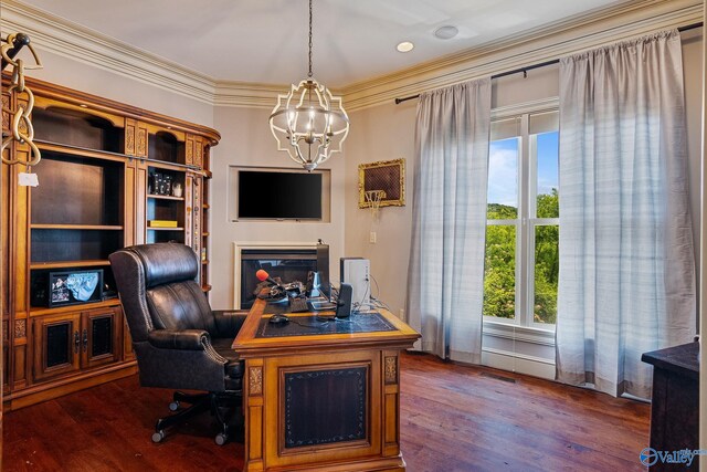 office featuring dark wood-type flooring, a notable chandelier, and crown molding