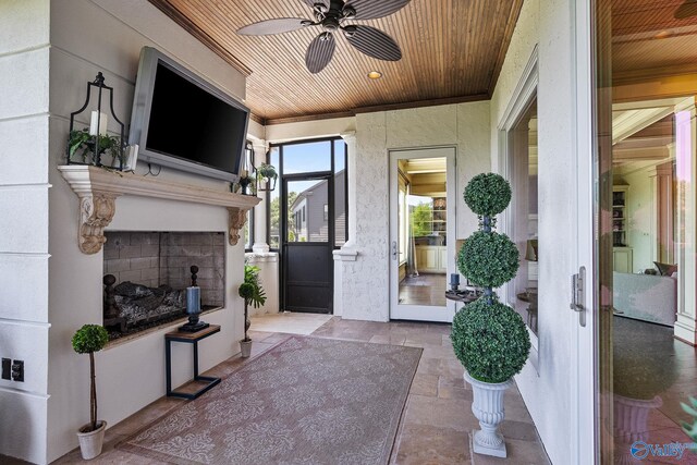 exterior space featuring ceiling fan and wooden ceiling