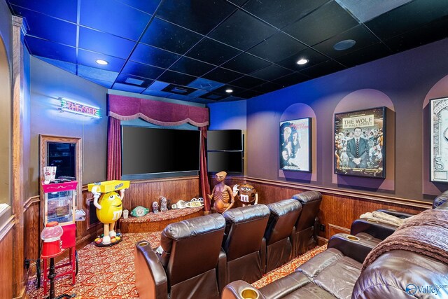 cinema featuring carpet floors and a drop ceiling