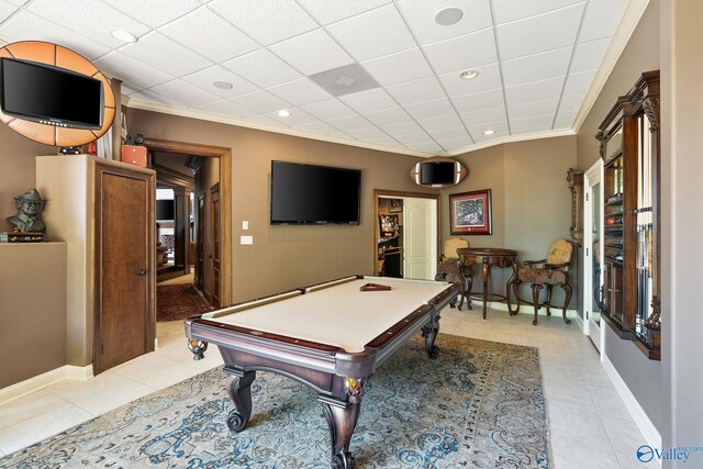 game room with crown molding, billiards, light tile patterned floors, and a paneled ceiling