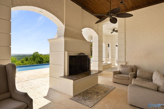 living room featuring a fireplace and wood ceiling