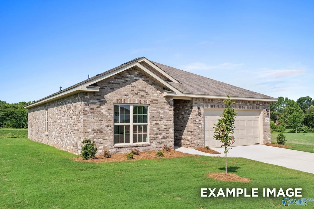 view of front of house with a garage and a front yard