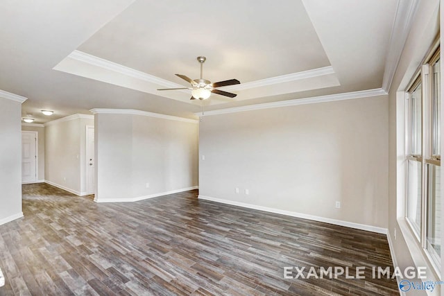 unfurnished room with a tray ceiling, ornamental molding, ceiling fan, and hardwood / wood-style flooring