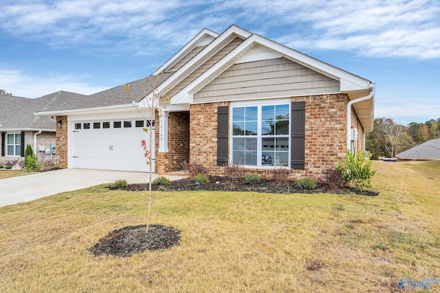view of front of home with a garage, brick siding, driveway, and a front yard