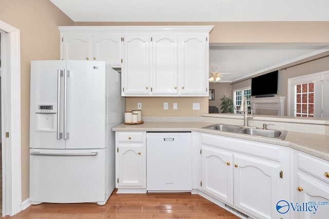 kitchen featuring sink, white cabinets, ceiling fan, white appliances, and light hardwood / wood-style flooring