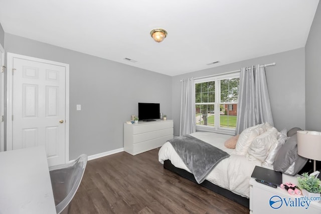 bedroom featuring dark wood-type flooring