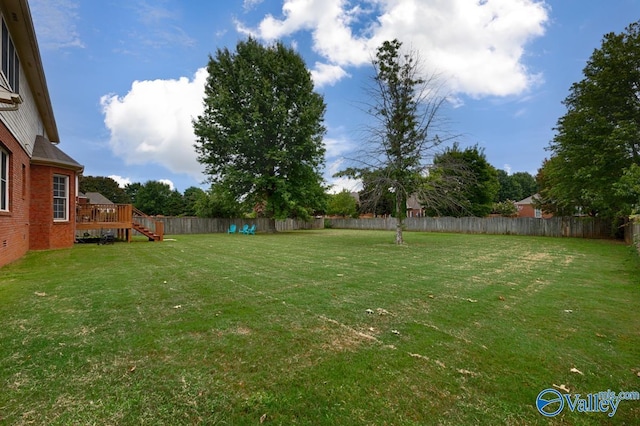 view of yard featuring a wooden deck