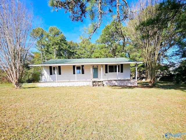 ranch-style home with a porch and a front yard