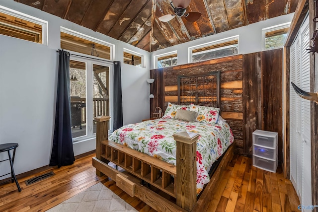 bedroom featuring lofted ceiling and hardwood / wood-style floors