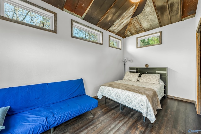 bedroom featuring multiple windows, dark hardwood / wood-style flooring, wooden ceiling, and lofted ceiling