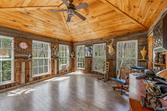 unfurnished office featuring lofted ceiling, hardwood / wood-style floors, wood ceiling, and a healthy amount of sunlight