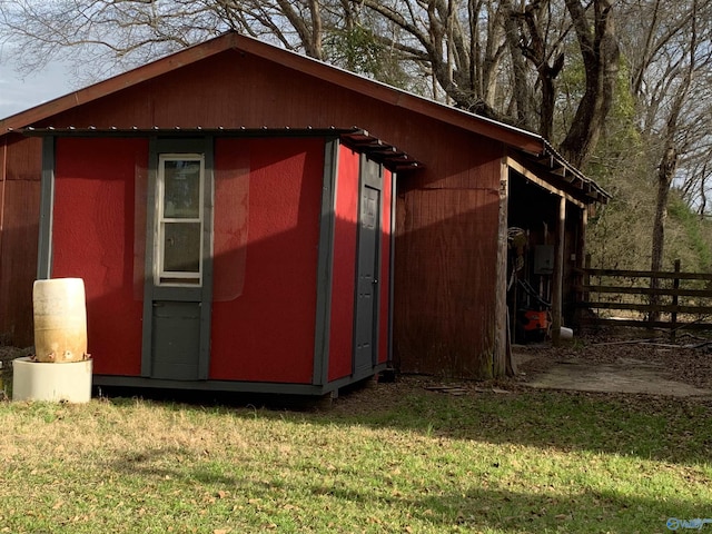 view of property exterior with a storage shed and a yard