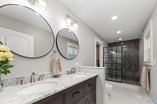 full bath with marble finish floor, a sink, and a walk in shower