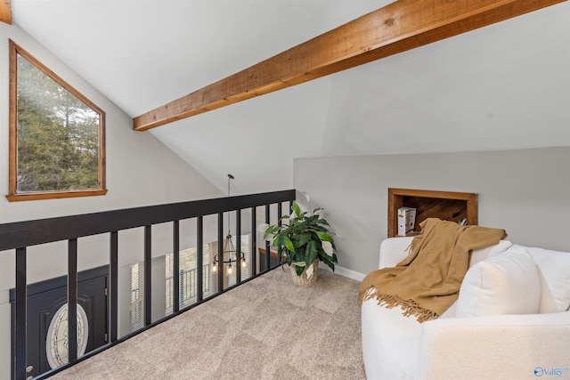 sitting room with vaulted ceiling with beams, carpet, and baseboards