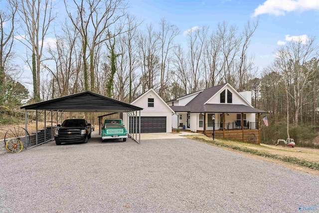 view of front of house with covered porch, driveway, and a chimney