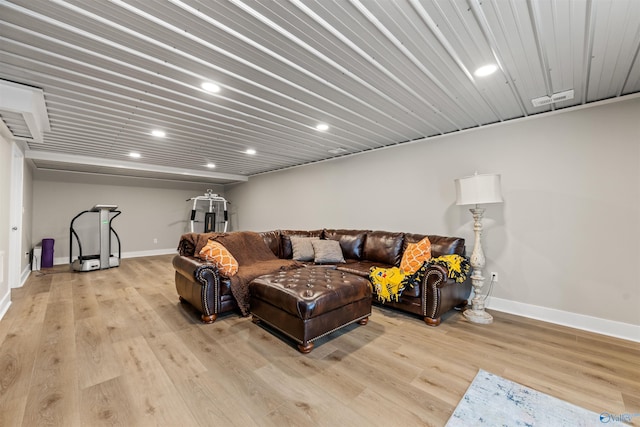 living area with light wood finished floors, recessed lighting, and baseboards