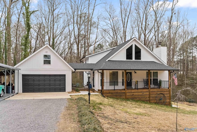 view of front facade with driveway, a garage, a shingled roof, a chimney, and a porch