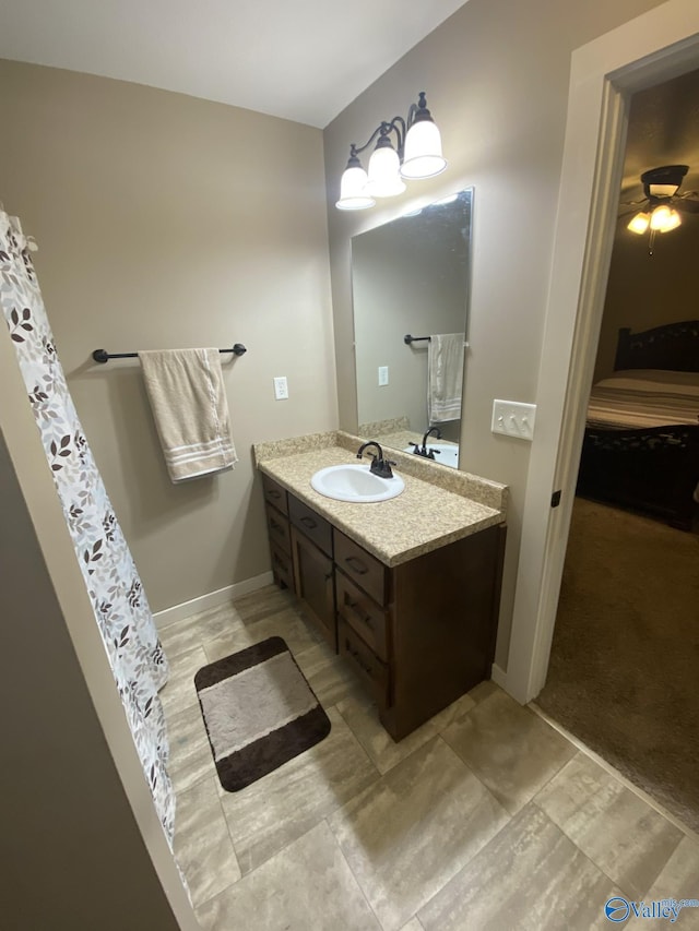 bathroom featuring ceiling fan and vanity