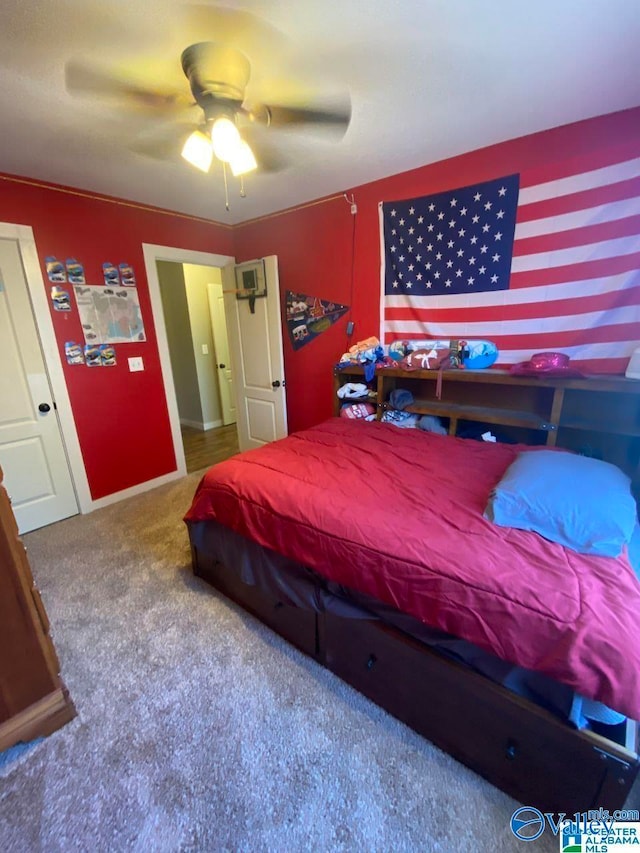 bedroom with ceiling fan and carpet floors