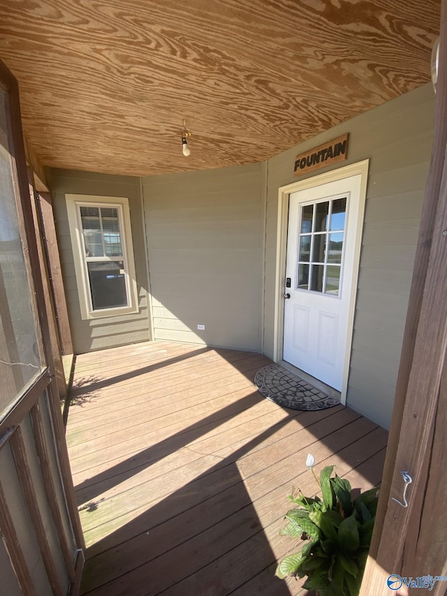 wooden terrace featuring covered porch