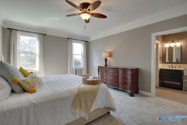 bedroom with light carpet, baseboards, a ceiling fan, ornamental molding, and ensuite bathroom