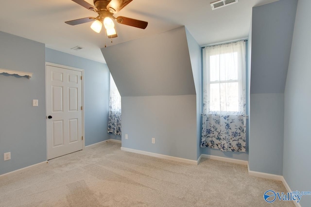 bonus room with carpet, visible vents, lofted ceiling, and baseboards