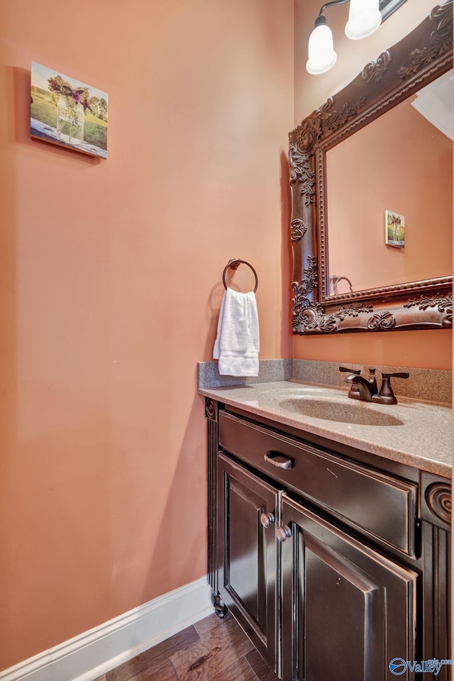 bathroom featuring baseboards and vanity