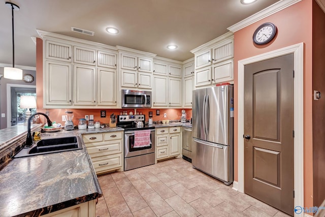 kitchen featuring recessed lighting, a sink, visible vents, appliances with stainless steel finishes, and crown molding