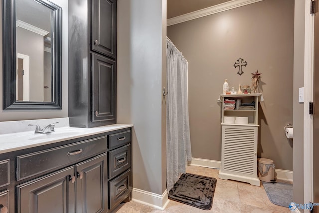 full bath with ornamental molding, vanity, and baseboards