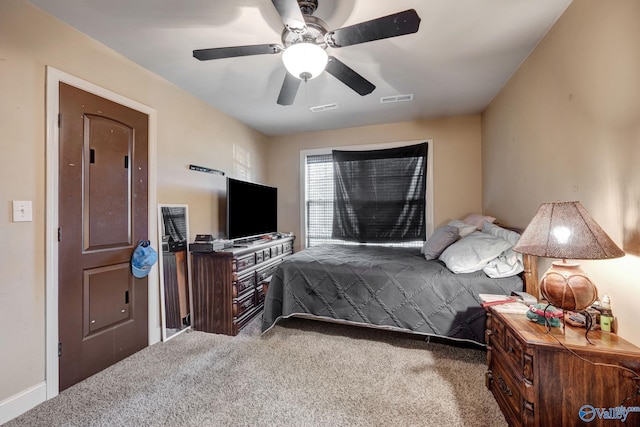 bedroom featuring a ceiling fan, visible vents, and carpet flooring