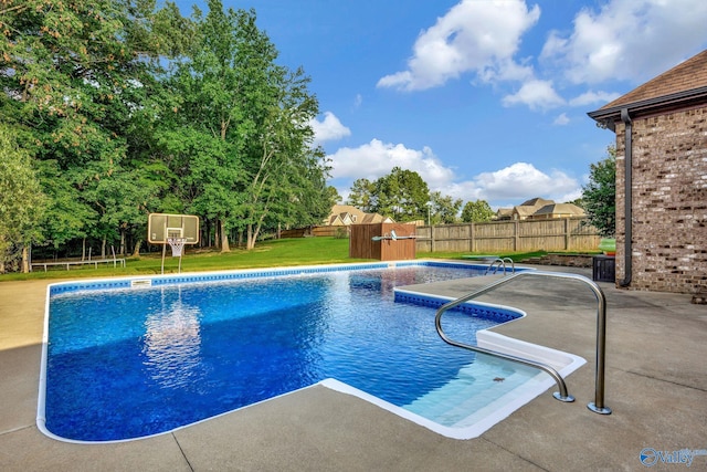 view of pool featuring a fenced in pool, a fenced backyard, a yard, and a patio