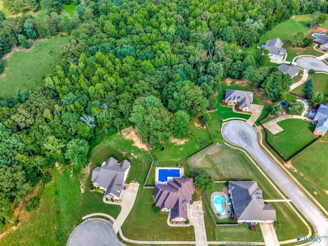 aerial view with a wooded view