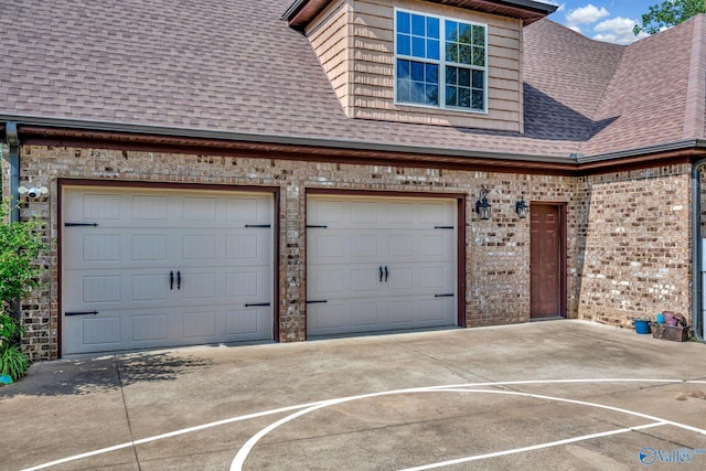 garage featuring driveway