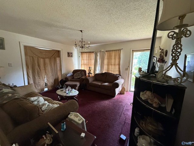 504 Joseph T Robinson, Gadsden, AL 35901 - living room featuring a textured ceiling, an inviting chandelier, and carpet floors