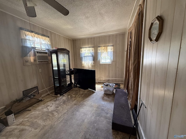 504 Joseph T Robinson, Gadsden, AL 35901 - living area with a wealth of natural light, wooden walls, a textured ceiling, and ceiling fan